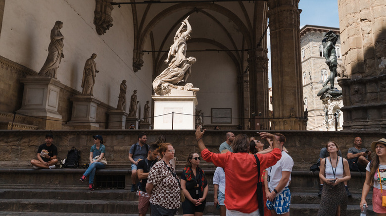 Tourists listening to a tour guide