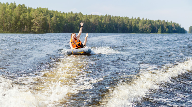 Teenage girl on a tube in lake