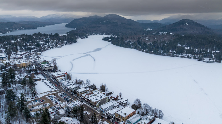 Aerial view of Lake Placid and Mirror Lake with mountains in background