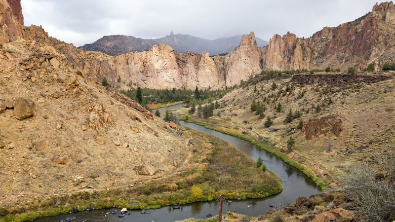In central Oregon high desert, overcast clouds move in over the Cooked River in Smith Rock State Park
