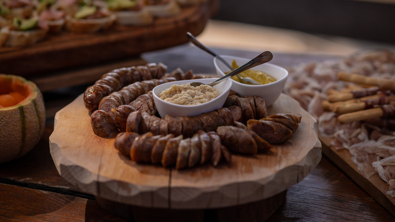 Slovenian sausage and charcuterie on a wodden cutting board