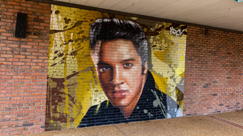 An Elvis Presley mural on a brick wall in Downtown Tupelo
