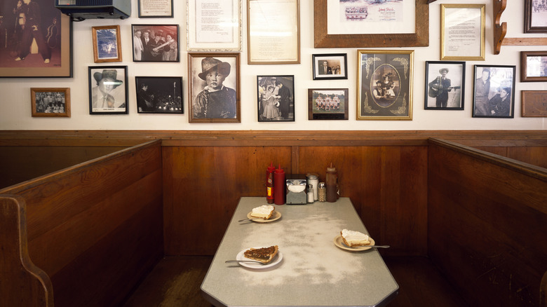 Pies on restaurant table with Elvis memorabilia on the wall