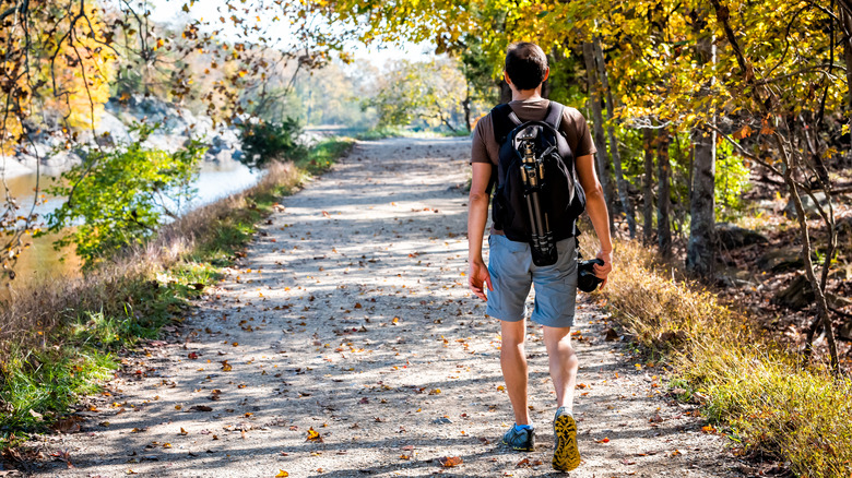 Hiker walking along Potomac River