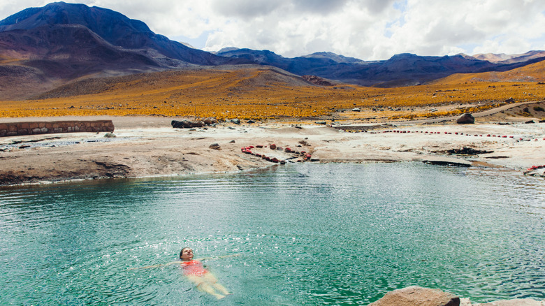 Woman bathing in a thermal pool in the Atacama Desert in Chile