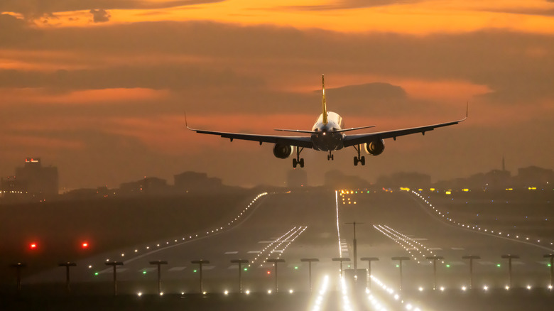 Plane landing at dusk