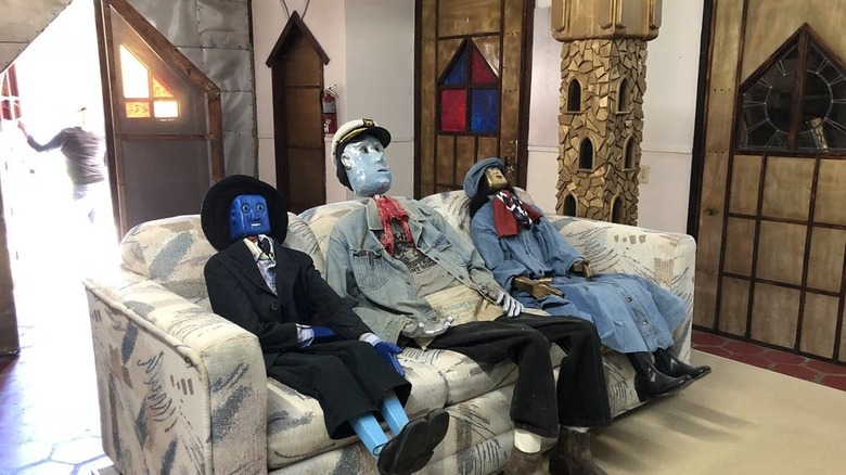 Life-sized Lego characters sit on a couch inside Solomon's Castle