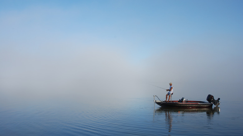 A man bass fishing from a boat in Florida