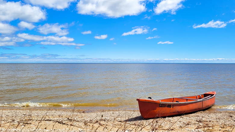 A small red canoe on Lake Winnipeg in Manitoba, taken near Gimli