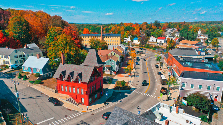 Aerial view of Somersworth and its fall foliage and abundant trees turning red, gold, and rust