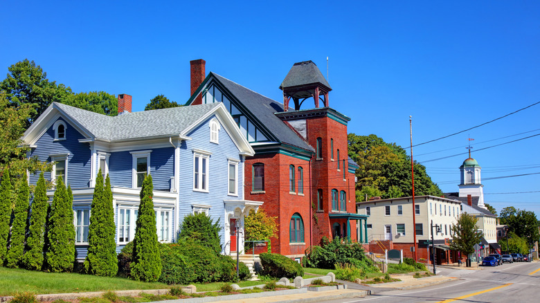 Historic homes in Somersworth along a road surrounded by green trees