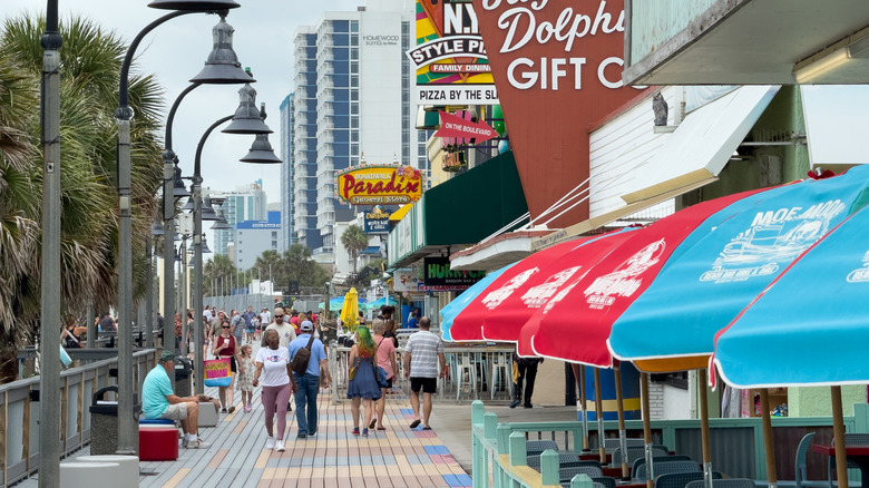 people walking by shops along Myrtle Beach boardwalk