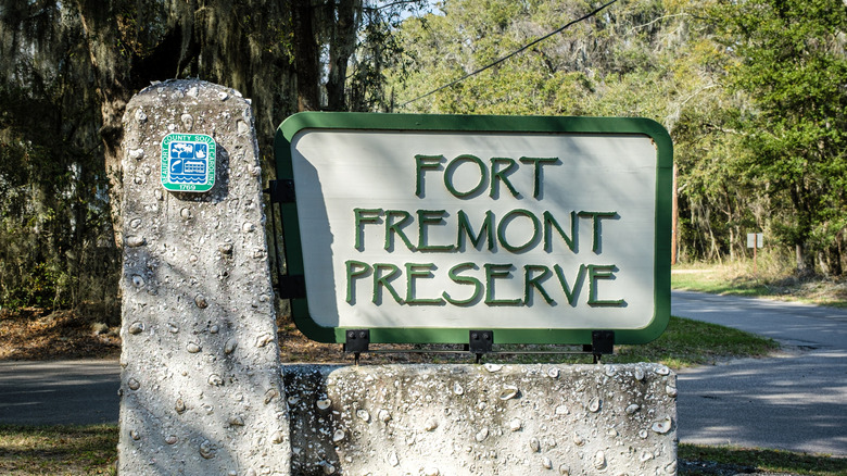 The entrance sign at Fort Fremont Historical Preserve with moss-covered trees in the background.