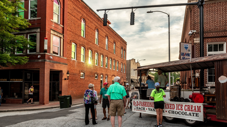 People walking along the brick downtown area of Greer, South Carolina