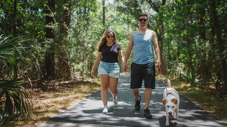 A couple walking their dog in South Carolina