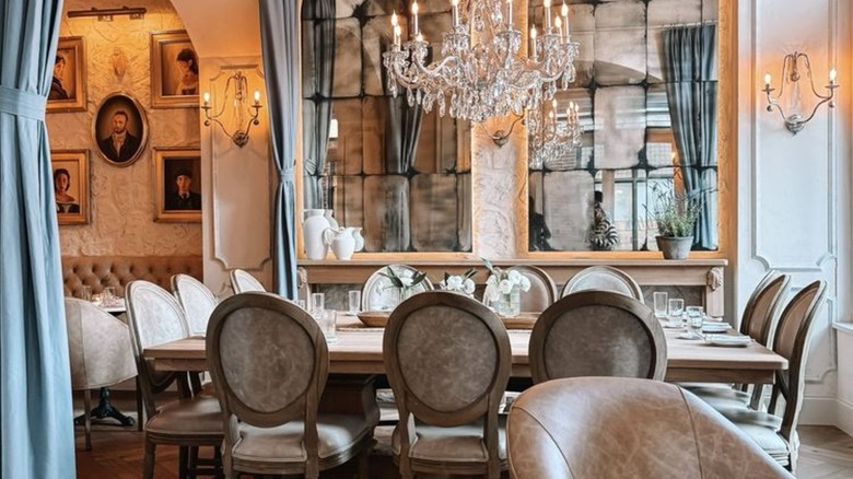 Resteraunt table with chandelier overhead at La Cave in Charleston