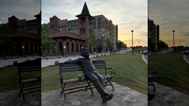 Statue of Einstein sitting on a bench at Bridgeway Station in Mauldin