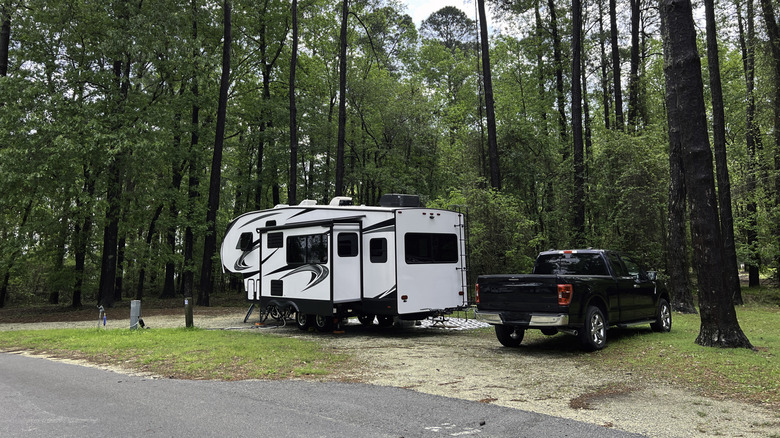 An RV camper and truck in Santee state park on Lake Marion South Carolina