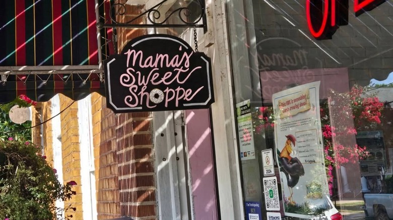 A store sign reading Mama's Sweet Shoppe