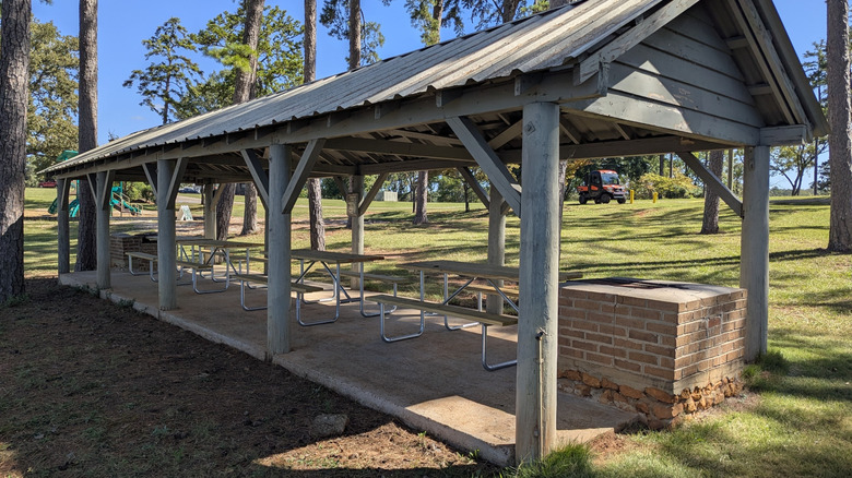 A picnic shelter with four tables and two grills in Pine Island State Park South Carolina