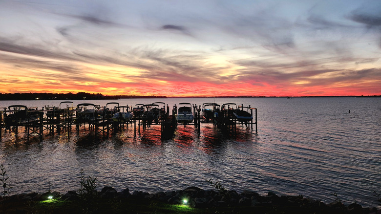 A red orange sunset over Lake Murray boat slips in South Carolina