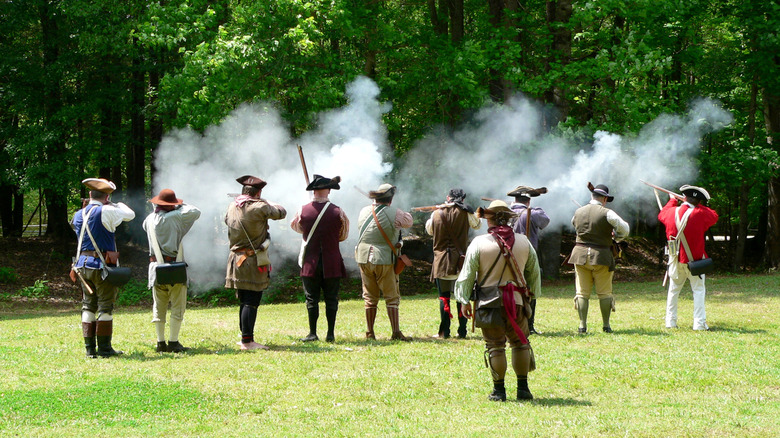 Reenactement of a Revolutionary War battle by costume-wearing staff at Musgrove Mill State Historic Site Laurens County, South Carolina