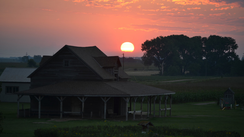 Sunrise over a farmhouse in De Smet, South Dakotaounded