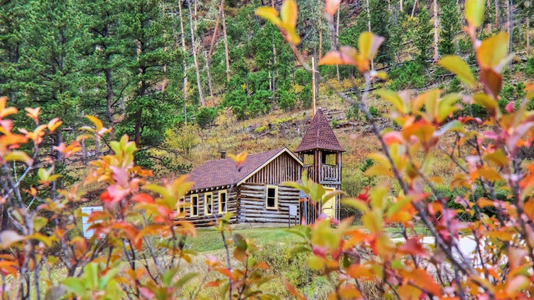 McCahan Memorial Chapel wooden structure seen through fall foliage Mystic South Dakota