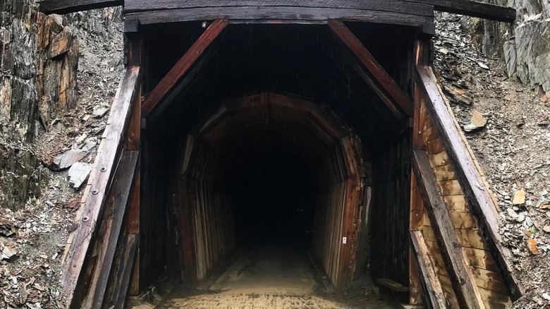 Black old wooden train tunnel Mickelson Trail Mystic South Dakota
