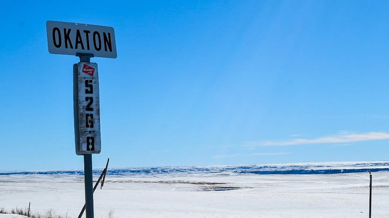 An old sign indicates the ghost town of Okaton, South Dakota