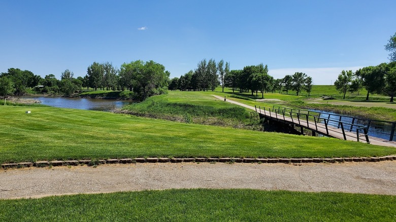 golf cart path along river at Fisher Grove Country Club