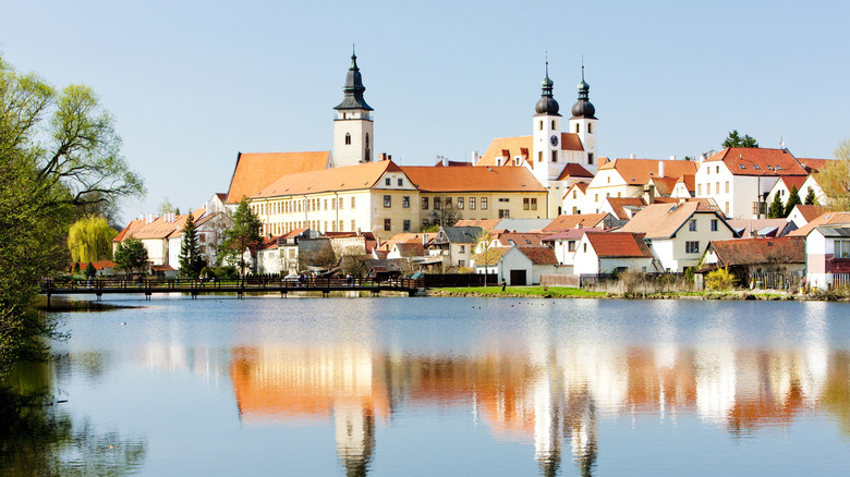Telč Castle reflected in a canal, in Telč, Czechia