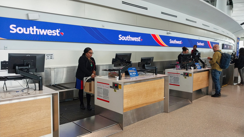 The bag drop counters at a Southwest check-in counter seem relatively quiet in 2025 since checked bags are no longer free for all customers