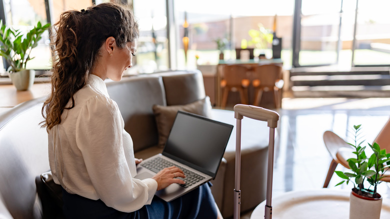 A woman sitting in an airport lounge