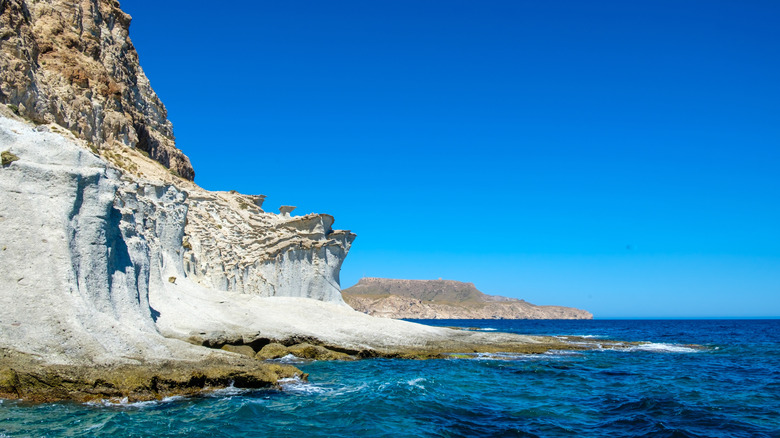 Striking fossilized white sand dunes cascade into the turquoise Mediterranean Sea at Spain's Cabo de Gata Natural Park