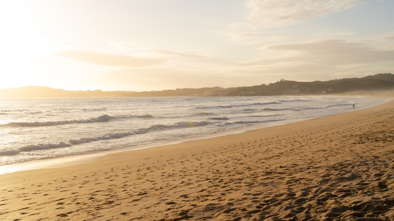 Waves breaking at a andy beach in La Lanzada