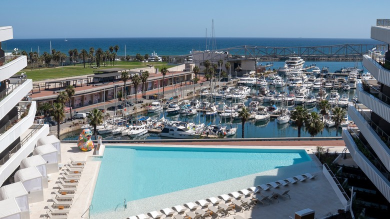 Exterior view of pool overlooking the Port Forum marina at SLS Barcelona