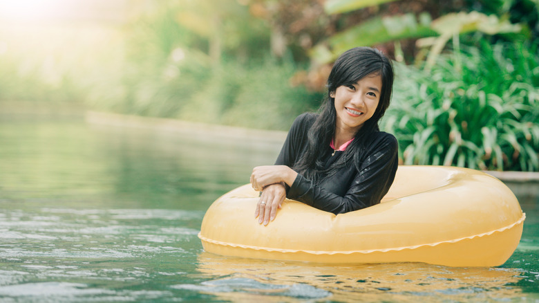 A woman floating down a lazy river