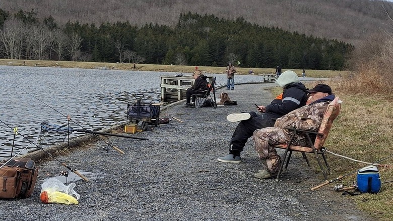 People fishing from shore at Spruce Knob Lake in West Virginia