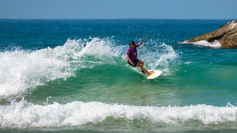 A surfer turns on a wave in Ahangama, Sri Lanka