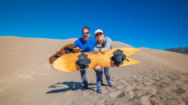Sandboarding couple