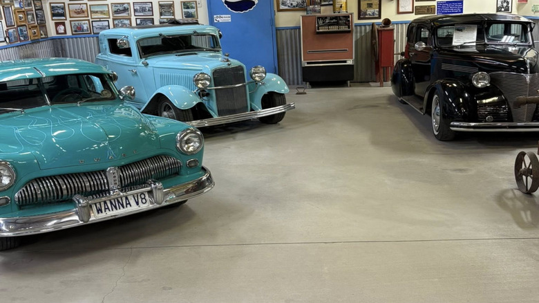 Three classic cars in a garage in Stanfield, Arizona