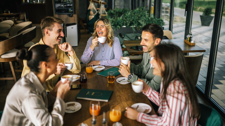 Friends having a happy gathering in a restaurant