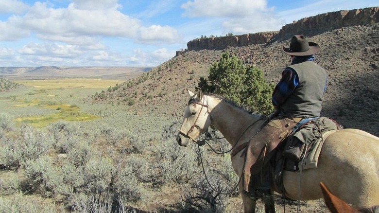 One person on horseback at Steens Mountain Guest Ranch