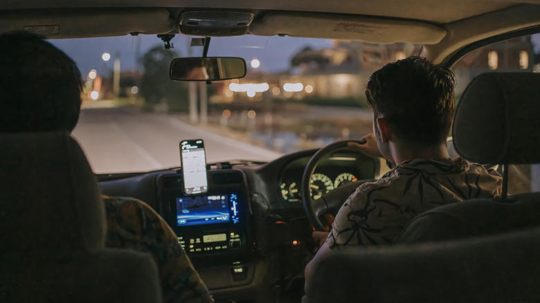 two people driving at night