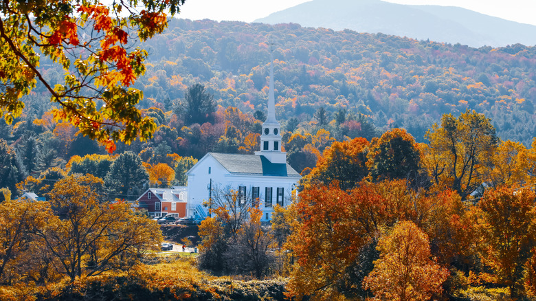 Stowe Community Church surrounded by vivid fall foliage