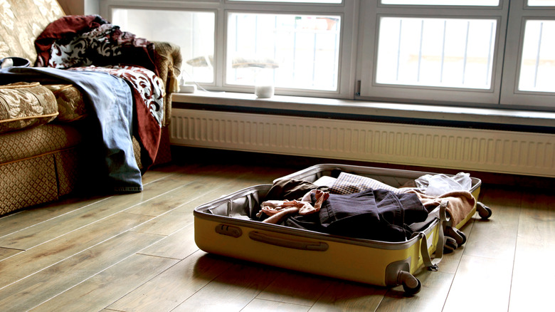 An open suitcase on the floor