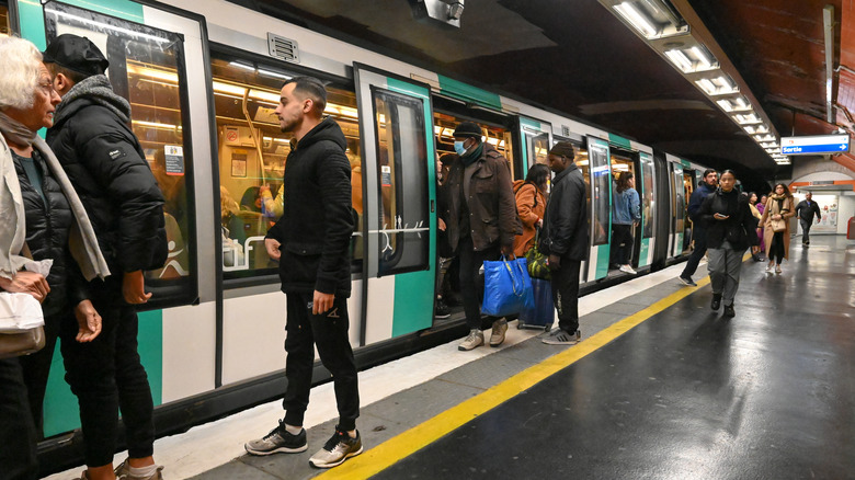 People boarding a metro in Paris