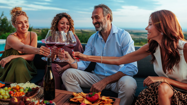 Friends sitting drinking wine
