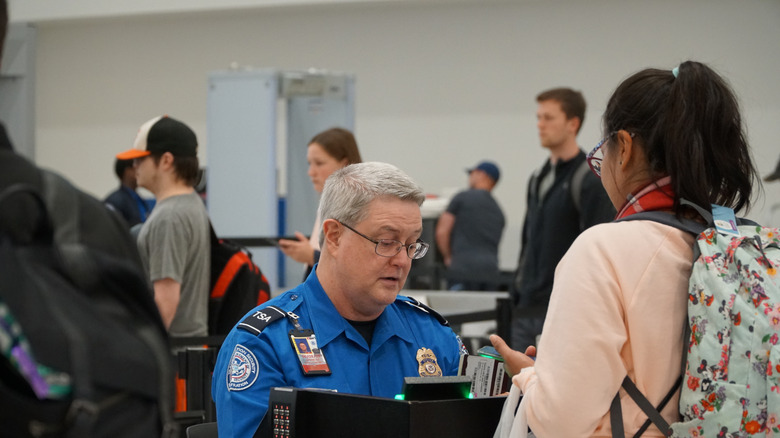 TSA officer wearing glasses